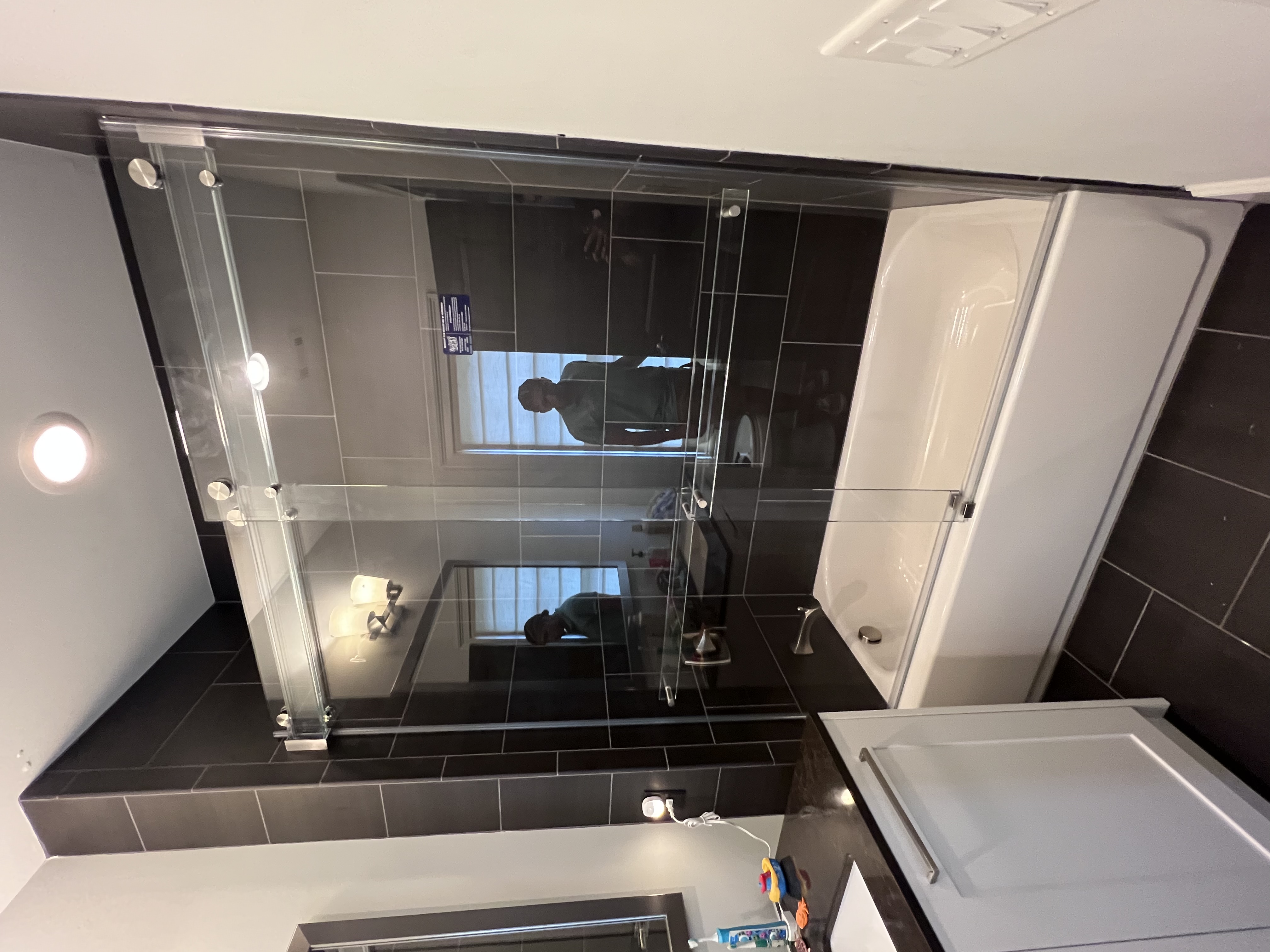 A Phantom slider on a tub is a great way to open up a small space and maximize functionality!