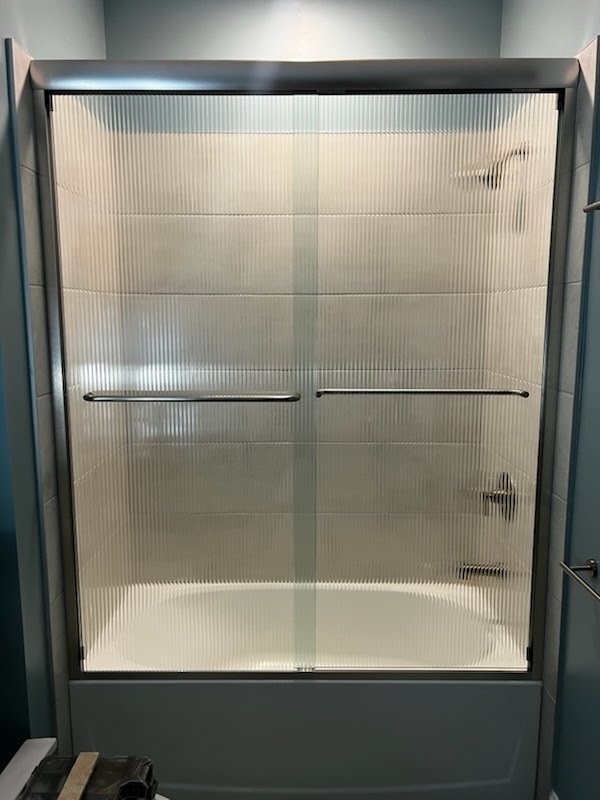 Check out this custom reeded glass on this sliding system!