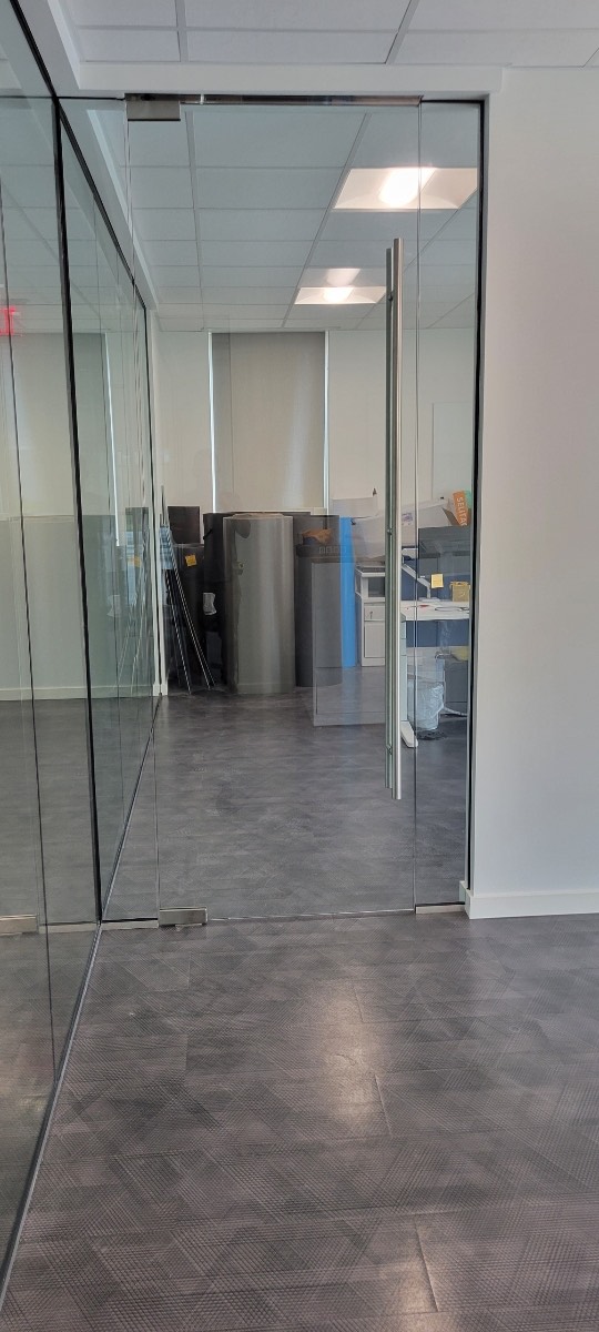 This is a commercial glass partition we've installed in an office building including a large, commercial ladder style handle!