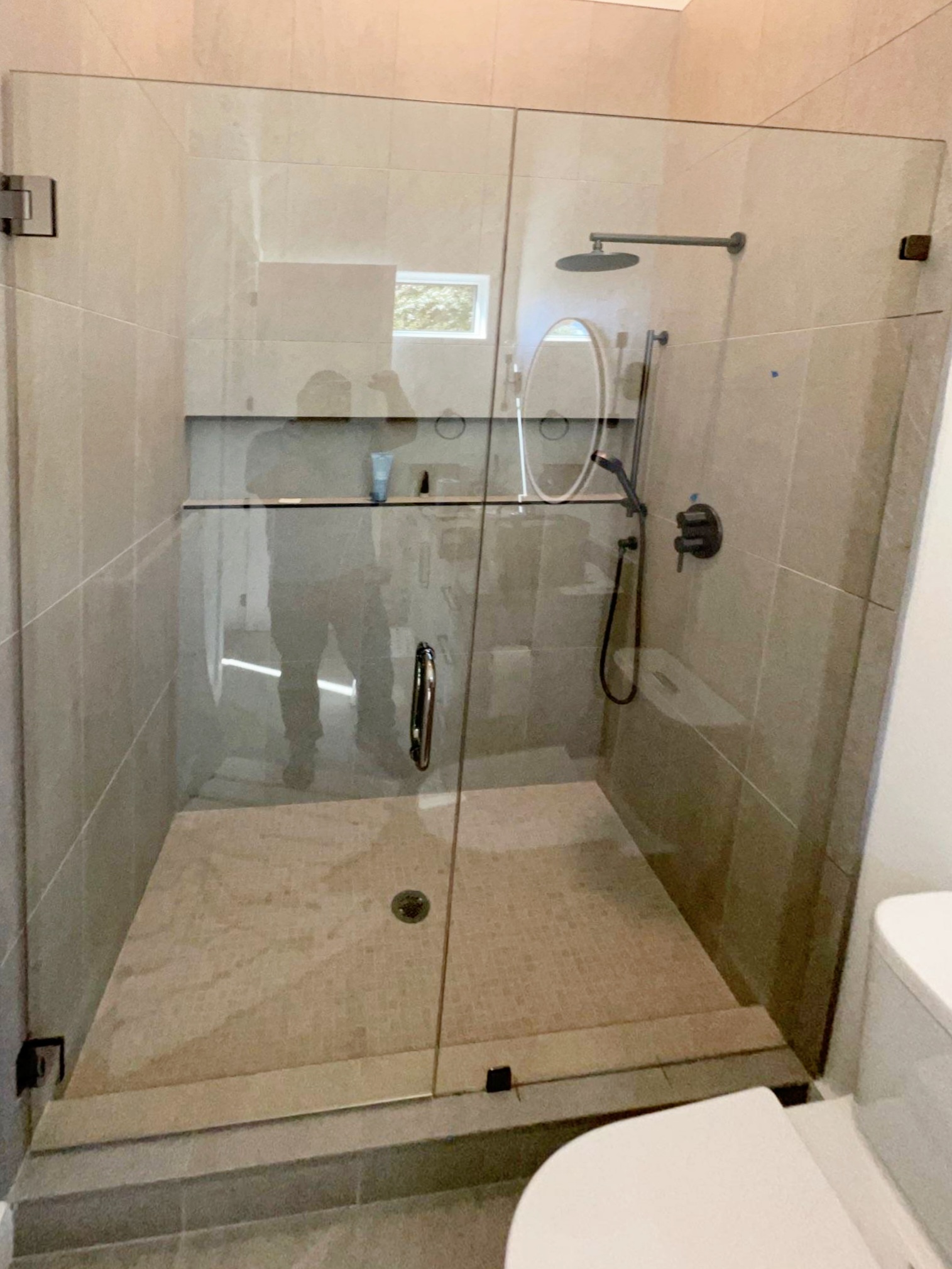 The hardware on this shower is a finish called Gun Metal! It is a dark polished color that can really pop in the right bathroom application!