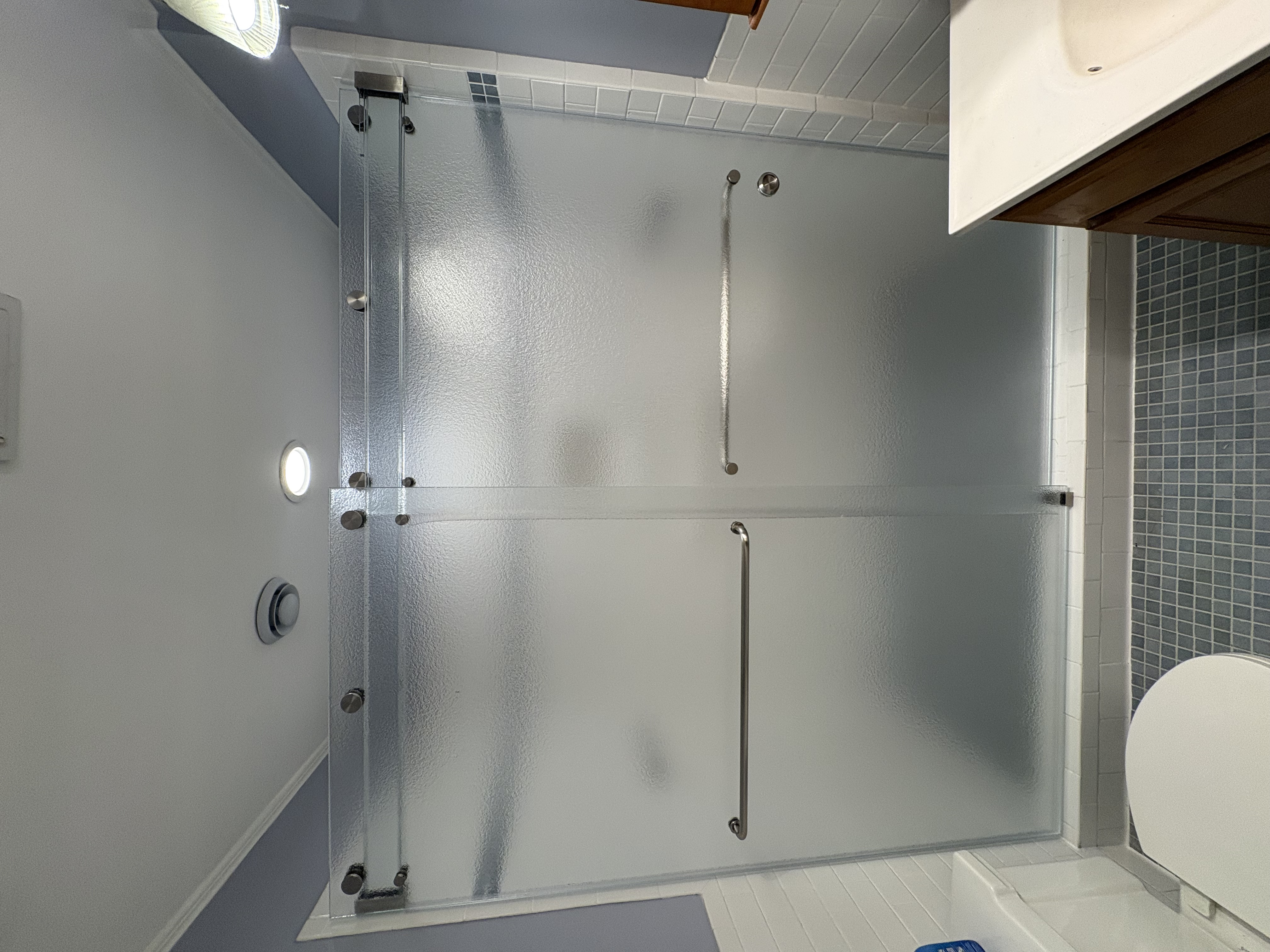 This is a custom Phantom bypassing slider from 310 Tempering with Tranquility custom cast glass from HMI Cardinal. We are thrilled to have the opportunity to design these one-of-a-kind enclosures!